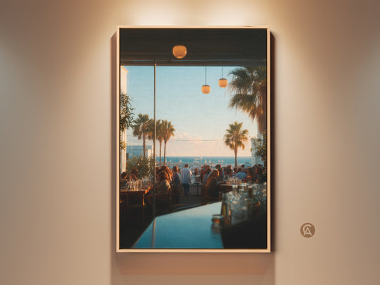 Framed canvas artwork showcasing a vibrant restaurant scene. Palm trees are visible through a large window. The artwork adds a touch of coastal charm to any space. This is a stunning piece that captures the essence of leisure and luxury. Perfect for home or office decor.