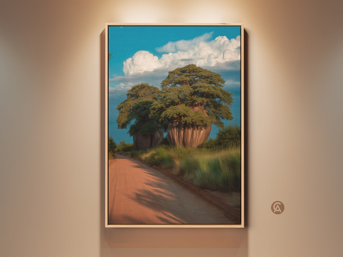 Framed scenic baobab tree artwork. This African landscape wall art features a dirt road a blue sky and fluffy clouds. Perfect boho home decor or travel gift idea. The realistic nature artwork adds wanderlust to any room.