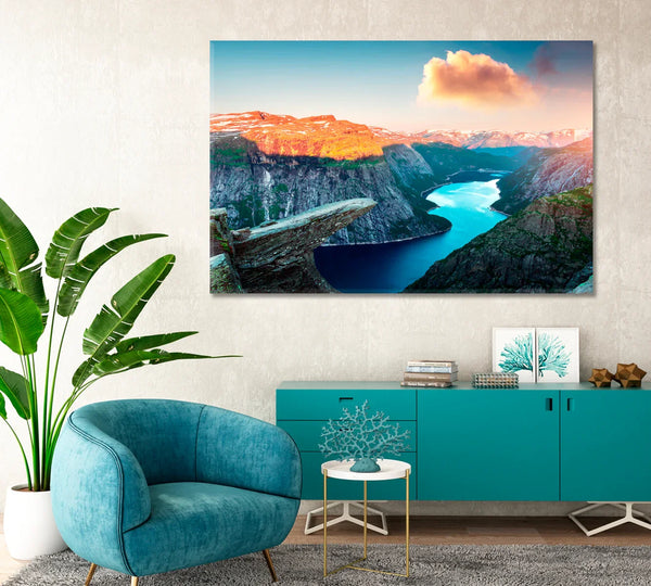 Trolltunga rock in Norway canvas above teal credenza