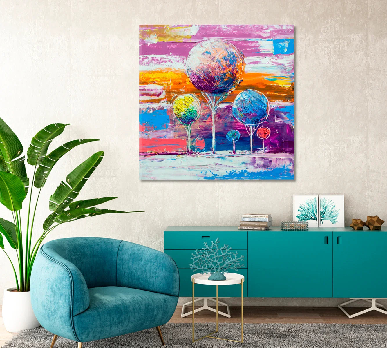 Abstract Multicolor Trees styled above a teal sideboard and modern lounge chair