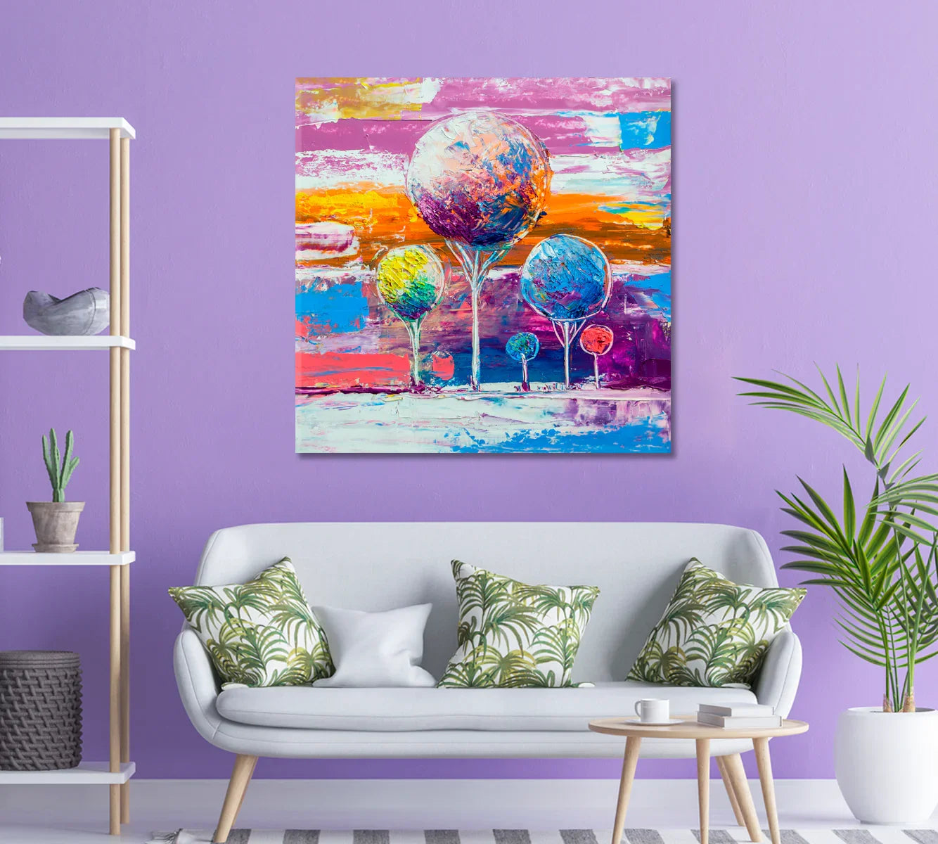 Vibrant abstract tree art against a lavender wall with palm-leaf pillows