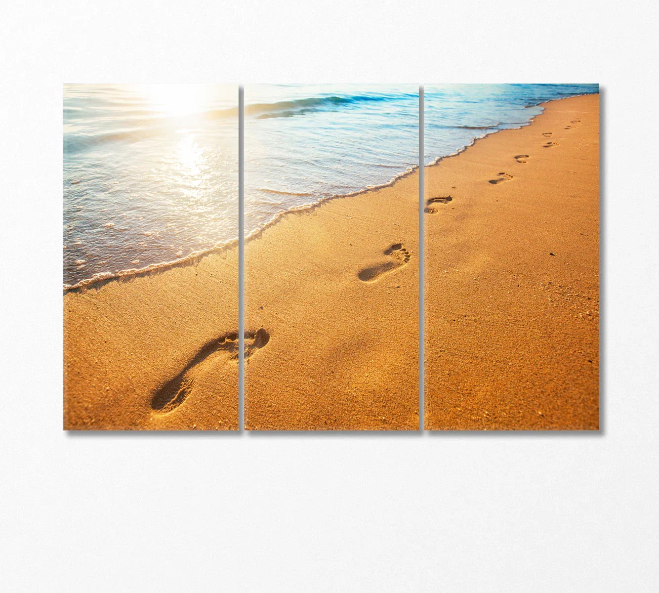 Triptych of sunlit shoreline with footprints—balanced spacing for reception walls.