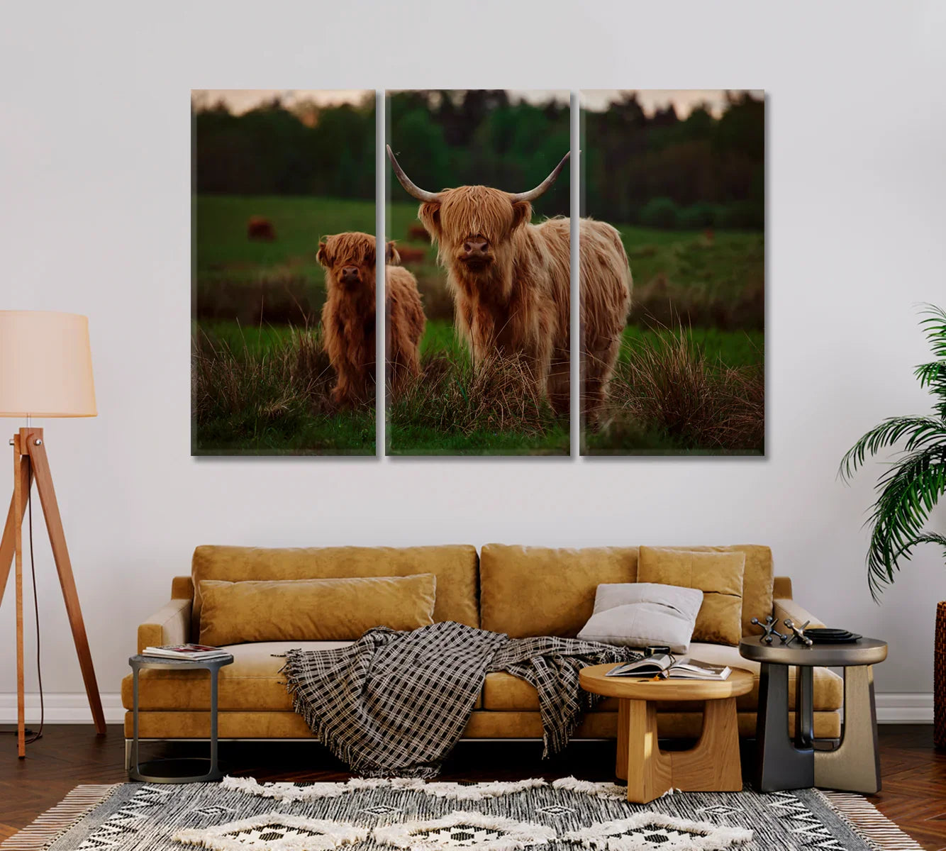 Three-panel Highland Cow mother and calf canvas set over a sofa.