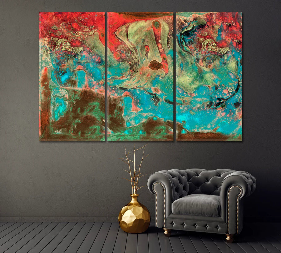 Artistic Abstraction in teal and red above gray armchair