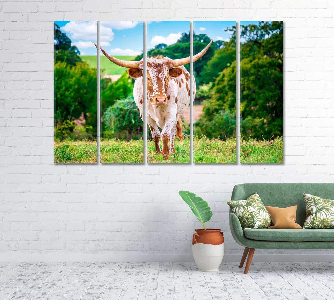 Living room mockup showing longhorn canvas in five-panel arrangement above a sofa