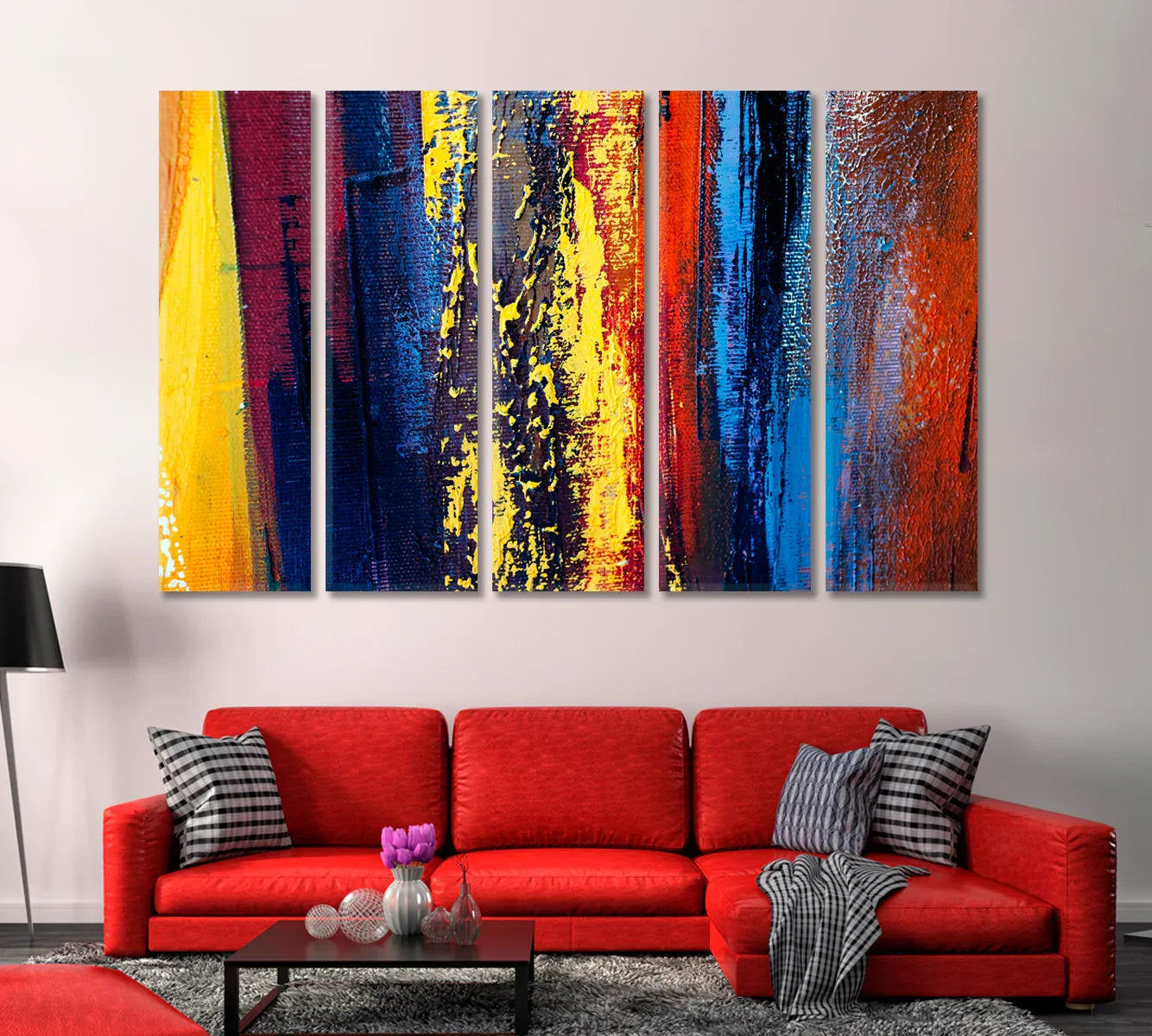 Five-panel canvas of saturated blue, red, and yellow brush textures above a red sofa