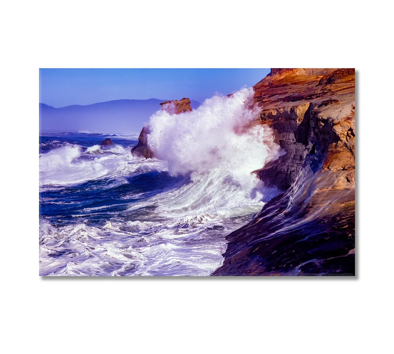 Waves crashing against rocks canvas print